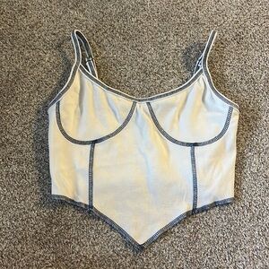 white top with blue stitching